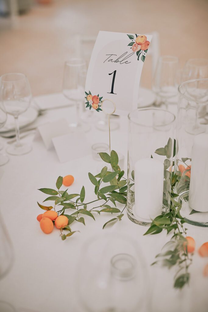 Wedding table decor including white flowers and candles