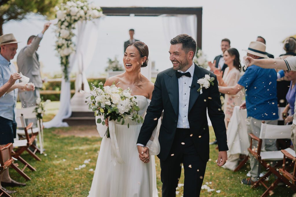 Bride and groom holding hands
