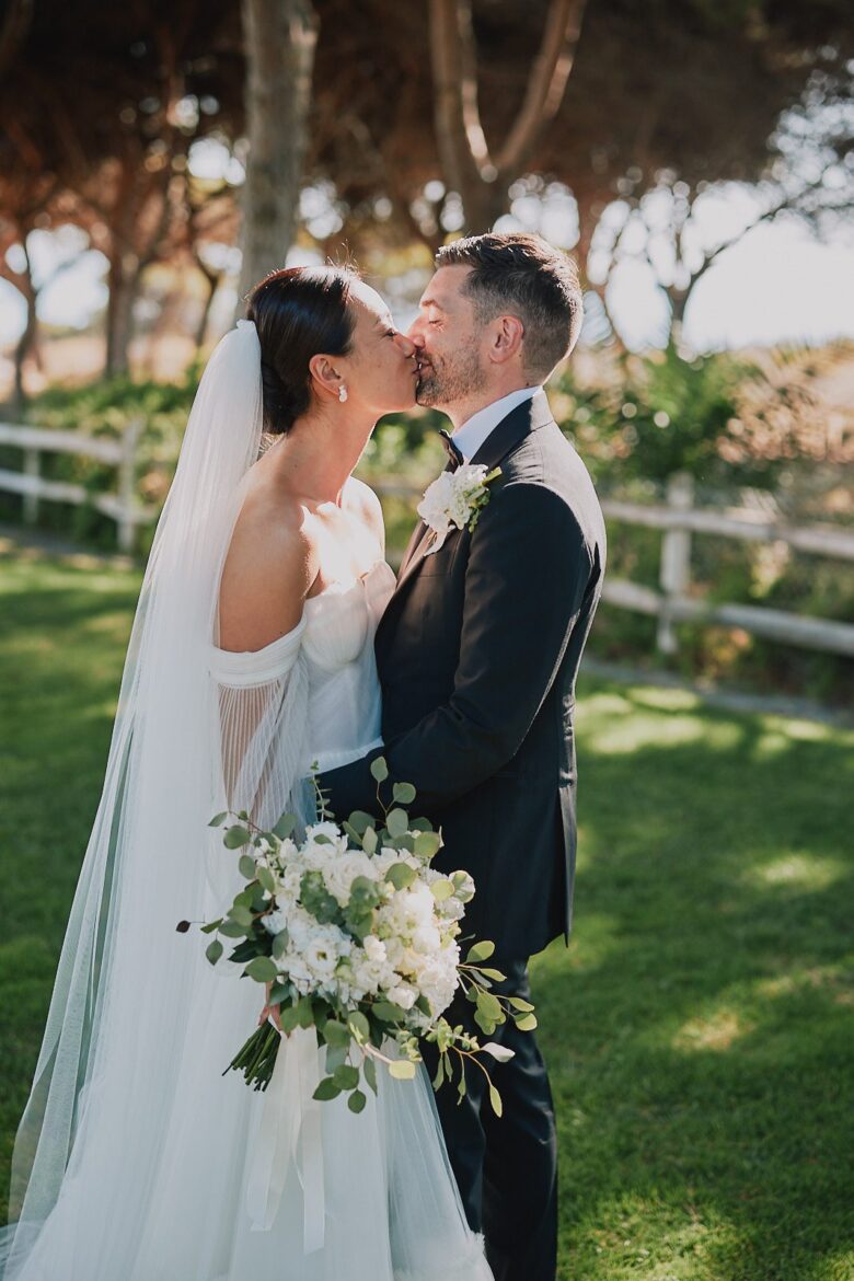 Bride and groom kissing