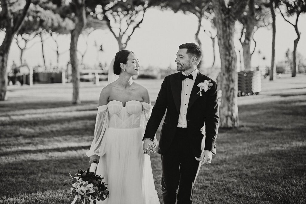 Bride and groom holding hands