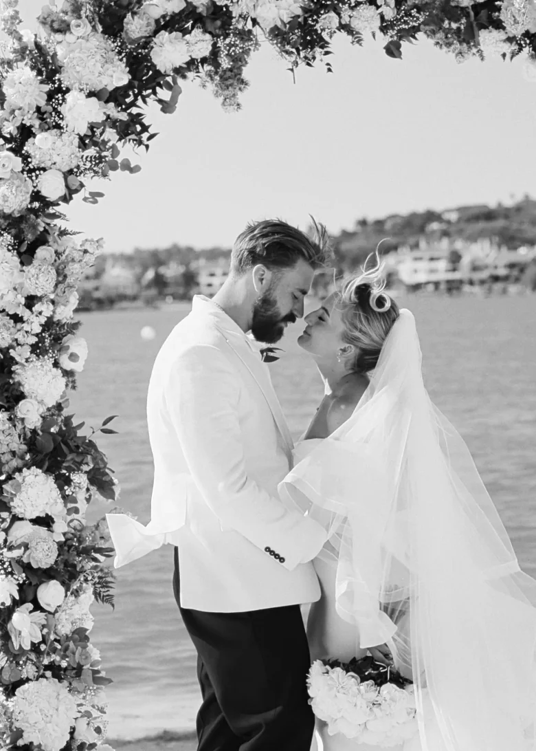 Bride and groom embracing by the water during their Casa do Lago wedding ceremony in Portugal